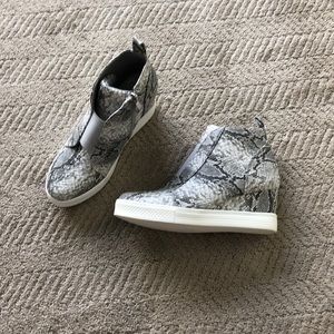 Snakeskin print wedges.